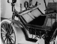 Daimler car from 1890. Two cyclinder rear-engine 2 HP with cooling water frame tubes and chain drive stearing.